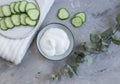 Cosmetic cream, face mask, scrub, cucumber, white bath towel Royalty Free Stock Photo