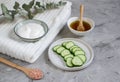 Cosmetic cream, face mask, scrub, cucumber, white bath towel Royalty Free Stock Photo