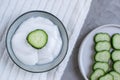 Cosmetic cream, face mask, scrub, cucumber, white bath towel Royalty Free Stock Photo