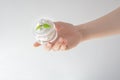 Cosmetic cream, female hand, skin care, white background, female spa treatments, natural composition