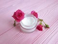 Cosmetic cream handmadeorganic, roses, pink wooden table Royalty Free Stock Photo