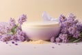 Cosmetic cream with lavender flowers on a beige background Royalty Free Stock Photo