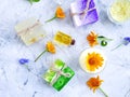 Cosmetic cream, oil freshness, soap, calendula flower on a gray concrete background Royalty Free Stock Photo