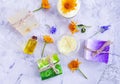 Cosmetic cream, oil freshness, natural soap, calendula flower on a gray concrete background Royalty Free Stock Photo