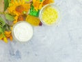 Cosmetic cream, oil, soap flower calendula relaxation a concrete background Royalty Free Stock Photo