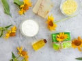 Cosmetic cream, oil, soap flower natural decoration calendula relaxation a concrete background Royalty Free Stock Photo