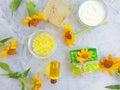 Cosmetic cream, oil, soap flower natural calendula relaxation a concrete background Royalty Free Stock Photo