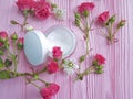 Cosmetic cream organic, roses, pink wooden Royalty Free Stock Photo