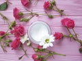 Cosmetic cream, roses, pink wooden Royalty Free Stock Photo