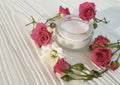 Cosmetic cream, roses, white wooden bright, bottle, Royalty Free Stock Photo