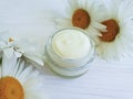 cosmetic skin cream camomile flower handmade treatment wooden background Royalty Free Stock Photo