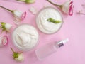 Cosmetic cream, wellness rose flower on a colored background