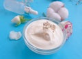Cosmetic cream, health organic wellness natural rose flower on a colored background