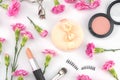 Cosmetic decorated with pink carnation Royalty Free Stock Photo