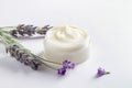 Cosmetic jar with face cream decorated with lavender flowers, herbal cosmetics concept Royalty Free Stock Photo