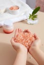 Cosmetic jar without label displayed. Pink himalayan salt can improve skin conditions and soothe sore muscles