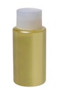 Cosmetic label template. Close-up of a closed gold yellow plastic bottle with shampoo isolated on a white background. Copy space