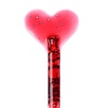 Cosmetic liquid dropper with red serum in pipette and in heart love shape with bubbles