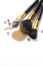 Cosmetic liquid foundation or cream, loose face powder, various brushes for apply makeup. Make up concealer smear and powder