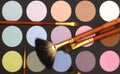 Cosmetic make-up background - eyeshadow and brush