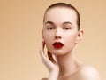 Cosmetic and Makeup. Beauty Fashion Model Woman face. Portrait with perfect skin. Red Lips and Nails Royalty Free Stock Photo