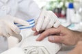 Cosmetic manicure treatment on a male hand. Sawing the nails of a man