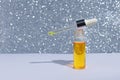 Cosmetic or medical bottle with pipette. Gold liquid product in glass bottle with dropper. Beauty concept. banner