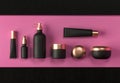 Cosmetic mock up set. Cosmetic black packaging bottles jar and tube. Make up blank face cream tube, spray. Trendy gold realistic Royalty Free Stock Photo