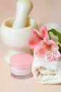 Cosmetic moisturizing cream towels and flower Royalty Free Stock Photo