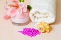 Cosmetic moisturizing cream towels and flower Royalty Free Stock Photo