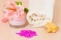 Cosmetic moisturizing cream towels and flower Royalty Free Stock Photo