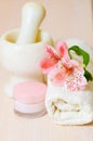 Cosmetic moisturizing cream towels and flower Royalty Free Stock Photo