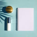 Cosmetic natural products on pastel blue background. Notebook for inscription