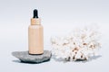 Cosmetic oil with natural Dead Sea minerals in wooden dropper bottle against white background