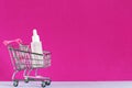 Cosmetic online shopping e-commerce concept. Serum bottle, hyaluronic acid for skin care in shopping trolley cart