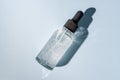 Cosmetic pipette with hyaluronic acid. Transparent gel with bubbles close-up. Gel cream or serum unbranded package. A sample of a