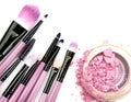 Cosmetic powder brush circle box and crushed blush palette on white. Royalty Free Stock Photo