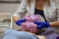 Cosmetic procedure. Woman in beauty salon with mask on her face. Face mask application. A woman makes an alginate mask Royalty Free Stock Photo