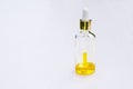 Cosmetic product in a glass bottle with a pipette and a drop, serum, essential oil