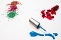 The cosmetic product on white background.Broken eyeshadow,cutted lipstick and nail color ,show color and texture