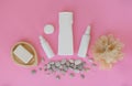 Cosmetic products for personal care on a pink background. Royalty Free Stock Photo