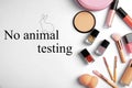 Cosmetic products and text NO ANIMAL TESTING on white background