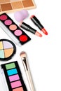 Cosmetic set. Eye shadow palette, lipsticks, color corrector, sponge, makeup brush and bronzer Royalty Free Stock Photo