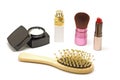 Cosmetic set with parfume blusher brush lipstic and comb on whit