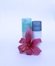 Cosmetic set for skin care on a white background with flowers lilies. Moisturizing Cream and Skin Scrub with a gentle pink lily f Royalty Free Stock Photo