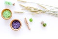 Cosmetic set with wheat herbs and sea salt in bottle on white table background flat lay Royalty Free Stock Photo