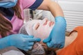 Cosmetic skin care. Woman in a beauty salon during a facial skin care procedure Royalty Free Stock Photo