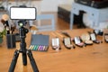 cosmetic & smartphone for recording video on beauty blogger table Royalty Free Stock Photo