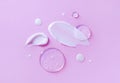 cosmetic smears cream texture on pastel pink background