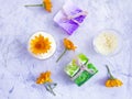 Cosmetic soap, cream, floral  freshness salt calendula flower on a gray concrete background Royalty Free Stock Photo